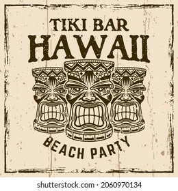 Hawaiian tiki wooden heads vector vintage emblem, badge, label, logo or t-shirt print. Illustration on background with grunge textures and frame vector illustration