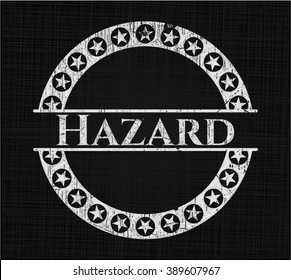 Hazard chalk emblem written on a blackboard