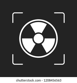 hazard, radiation. simple silhouette. White object in camera autofocus on dark background