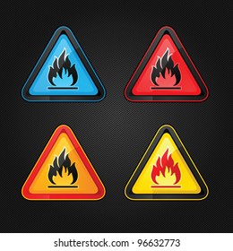 Hazard warning triangle highly flammable warning set symbols on a metal surface