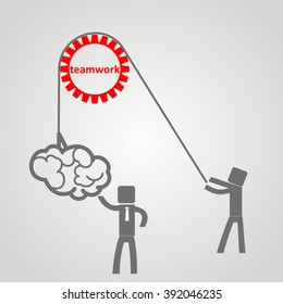 he concept of teamwork - a man holds up a brain on a rope