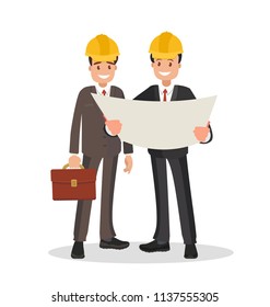 he customer and the contractor. Men dressed in business suits and helmets discussing the project.
