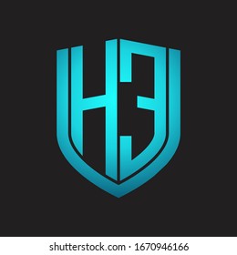 HE ogo monogram with emblem shield design isolated with blue colors on black background