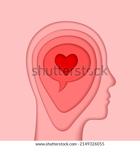 Head, brain and heart concept. Human mind silhouette, profile face outline and heart shape symbol as emotional intelligence or self love concept in paper cut art.