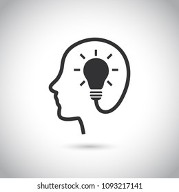 Head with bulb icon on gray background.