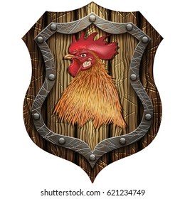 The head of the cock on oak Gothic knight shield with rivets