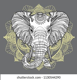 The head of an elephant. Meditation, coloring of the mandala. Large horns and long trunk. Elephants with tusks. Drawing manually, templates. Strips, points, arrows. Spots of watercolor paint, spray. 