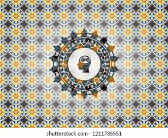 head with gears inside icon inside arabesque emblem. arabic decoration.