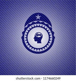 head with gears inside icon inside badge with denim texture