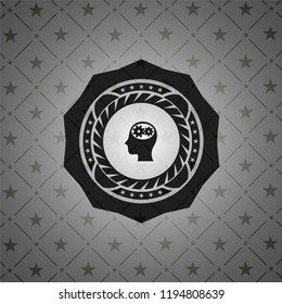 head with gears inside icon inside black badge
