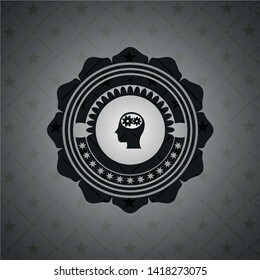 head with gears inside icon inside black badge