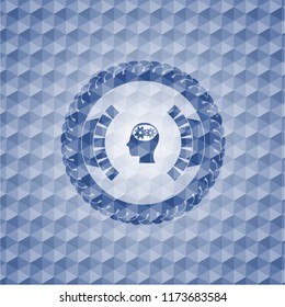 head with gears inside icon inside blue badge with geometric pattern.
