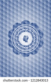 head with gears inside icon inside blue hexagon emblem.