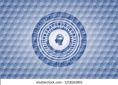 head with gears inside icon inside blue hexagon emblem.