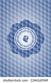head with gears inside icon inside blue badge with geometric pattern background.