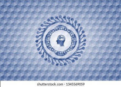 head with gears inside icon inside blue emblem or badge with abstract geometric pattern background.