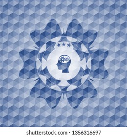 head with gears inside icon inside blue emblem with geometric background.