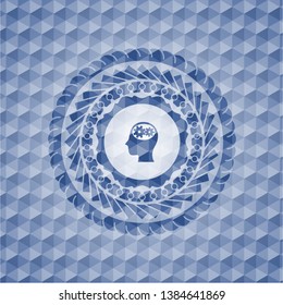 head with gears inside icon inside blue hexagon emblem.
