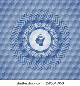 head with gears inside icon inside blue emblem or badge with abstract geometric pattern background.