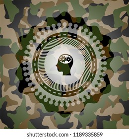 head with gears inside icon inside camo emblem