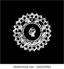 head with gears inside icon inside chalk emblem written on a blackboard