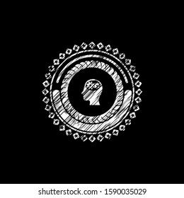 head with gears inside icon inside chalk emblem written on a blackboard