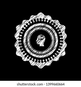 head with gears inside icon inside chalkboard emblem on black board