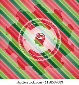 head with gears inside icon inside christmas style badge..