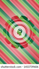 head with gears inside icon inside christmas colors style badge.