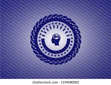 head with gears inside icon inside denim background