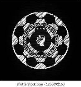 head with gears inside icon drawn on a chalkboard