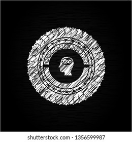 head with gears inside icon drawn on a blackboard