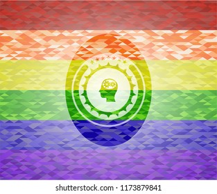head with gears inside icon inside emblem on mosaic background with the colors of the LGBT flag
