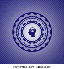 head with gears inside icon inside emblem with jean background