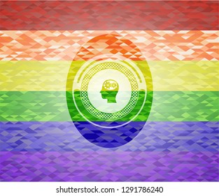 head with gears inside icon inside emblem on mosaic background with the colors of the LGBT flag
