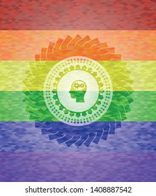 head with gears inside icon inside emblem on mosaic background with the colors of the LGBT flag