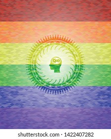 head with gears inside icon inside emblem on mosaic background with the colors of the LGBT flag