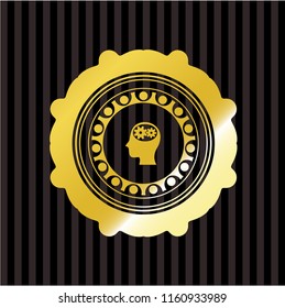 head with gears inside icon inside gold badge or emblem