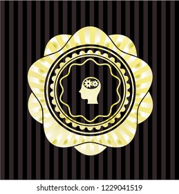 head with gears inside icon inside gold shiny emblem
