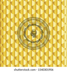 head with gears inside icon inside gold shiny badge. Scales pattern. Vector Illustration. Detailed.