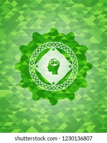 head with gears inside icon inside green emblem with mosaic ecological style background