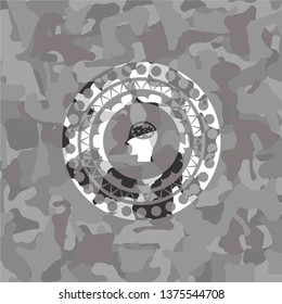 head with gears inside icon inside grey camo emblem