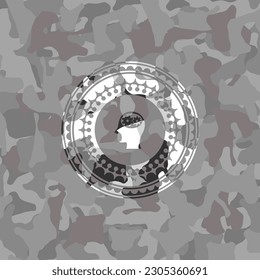 head with gears inside icon inside grey camouflage texture. 