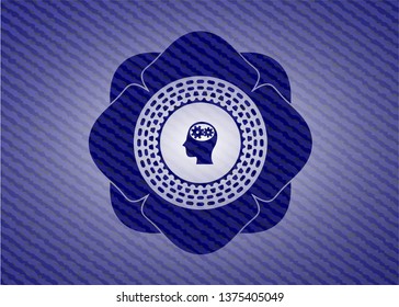 head with gears inside icon inside jean or denim emblem or badge background