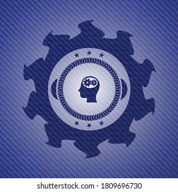 head with gears inside icon inside jean or denim emblem or badge background. 