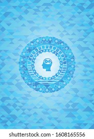 head with gears inside icon inside light blue mosaic emblem