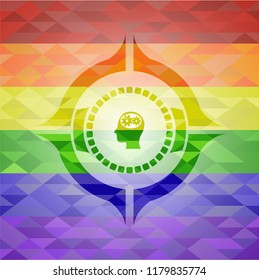 head with gears inside icon on mosaic background with the colors of the LGBT flag