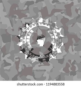 head with gears inside icon on grey camo pattern