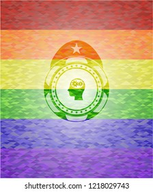 head with gears inside icon on mosaic background with the colors of the LGBT flag