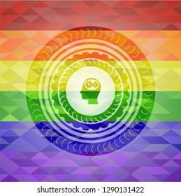 head with gears inside icon on mosaic background with the colors of the LGBT flag